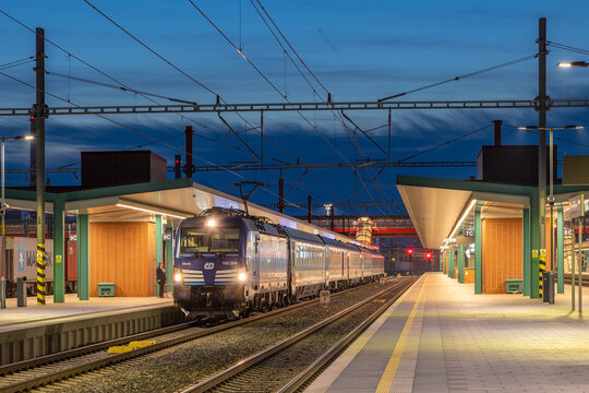Pardubice, Czech Republic - Ferbuary 22 2025: R 895 Slovacky expres just arrived at the railway station Pardubice hlavn&iacute; n&aacute;draž&iacute; in the evening with a Siemens Vectron locomotive leading the way.