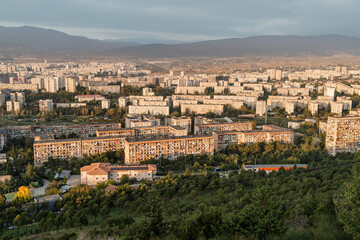 Fototapeta premium Soviet era buildings in Tbilisi, Georgia. View from the Chronicle of Georgia overlooking Soviet-era apartment buildings and the cityscape below.