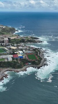 Vina del Mar in Chile with a rainbow. Beautiful aerial image of the coastline. Aerial view, vertical video