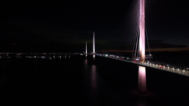 Aerial drone fly towards the Queensferry Crossing over the Firth of Forth, Edinburgh Scotland