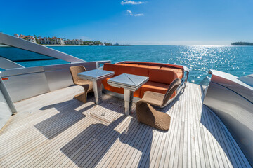 Fototapeta premium Luxury yacht sun deck lounge with table and ocean view