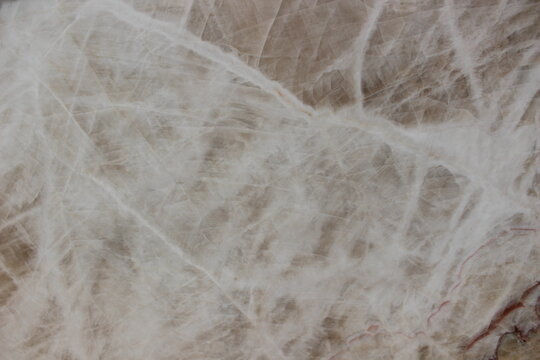 White crystal onyx marble texture with elegant brownish fine veins for luxury interior materials.
