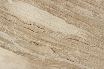 Obraz premium Close up of tan beige Serpeggiante marble stone texture with natural sedimentary line patterns for architectural background.