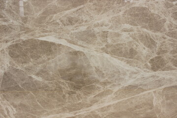 Fototapeta premium Detail of polished Tundra Grey marble showing the beauty of white calcite veins on a grey stone surface.