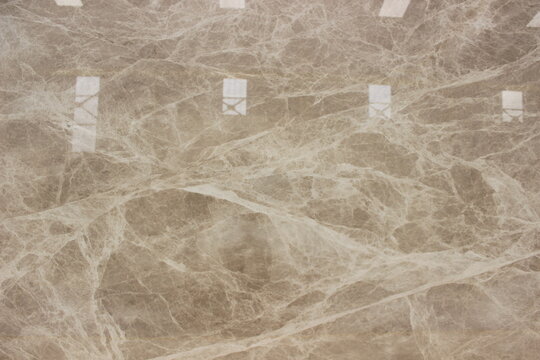 Tundra Grey marble texture with random white veins forming a captivating spider web pattern.