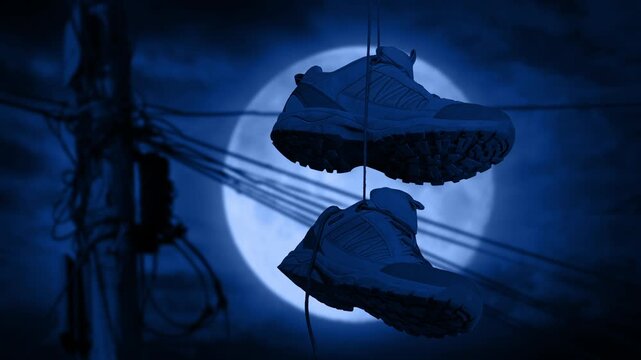 Shoes Hanging Off Wire At Night City Detail