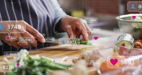 Chopping Indian cook slicing green onions with knife on board in striped apron, social overlay © vectorfusionart