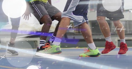 Naklejka premium Showing players lower bodies racing on blue court, in sport shorts, crew socks, neon green sneakers