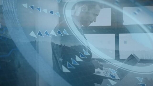Man opening laptop and typing in tech office reviewing report, HUD rings and arrows overlaying