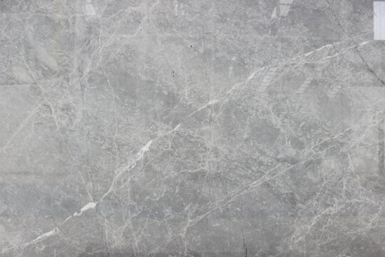 Silver Shadow marble surface texture with unique crisscross vein patterns for premium building materials.
