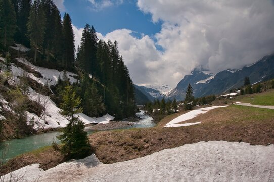 River flowing through an alpine landscape in early spring, Urnerboden, Urner Boden, Uri, Switzerland