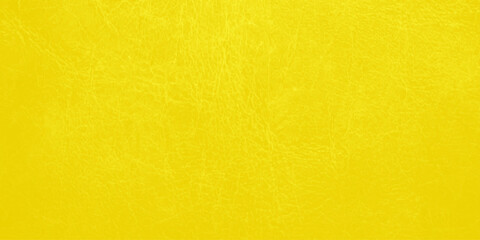Obraz premium yellow wall background. A vintage background featuring a dirty grunge texture on an aged yellow wall with a stained parchment pattern and a rough antique surface design