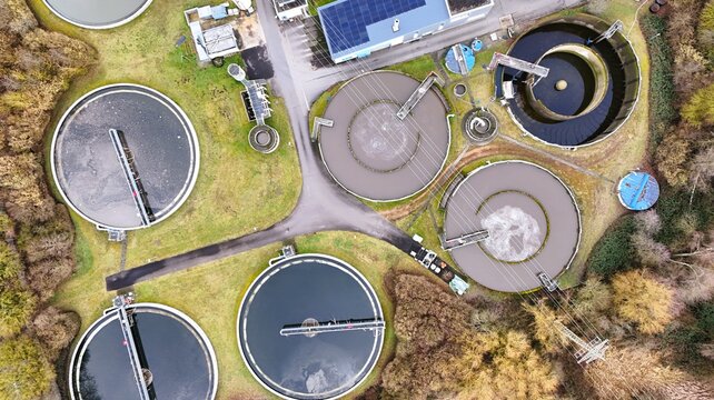 Aerial View of Modern Wastewater Treatment Plant with Circular Clarifiers	

