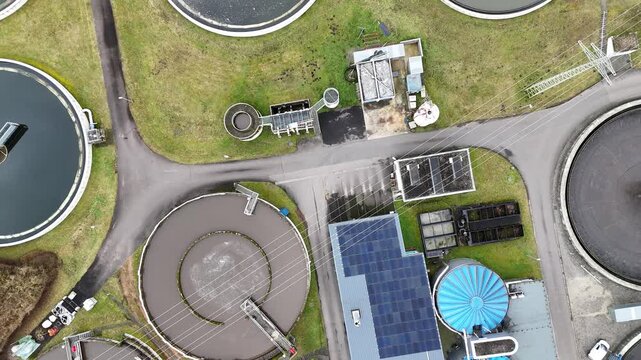 Aerial View of Modern Wastewater Treatment Plant with Circular Clarifiers	
