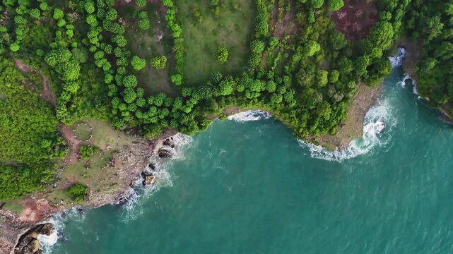Beautiful coastal cliffs of bizarre shapes with natural arches and wild beaches in the rays of the setting sun. Etretat, France, cliffs on the banks of the English Channel, drone video