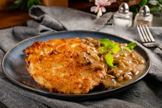 Sauerkraut pancakes (fuczki) with mushroom sauce - a traditional Lemko dish.