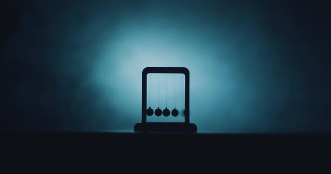 Newtons cradle swinging close up