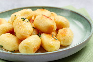 stuffed gnocchi with cheese, Italian dumplings, garnished with parmesan cheese, no people,