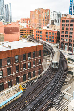 Chicago L train traveling on elevated railway tracks