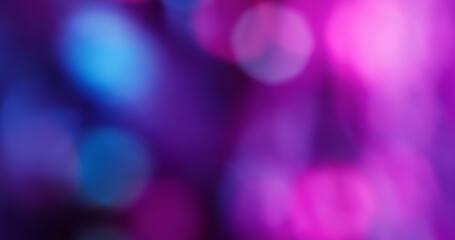 Blur flare light. Neon bokeh background. Defocused blue purple pink color glint round glisten on illuminated art visual abstraction.