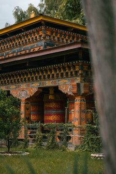 Paro, Bhutan - 16 September 2025: View of the ancient Kyichu Lhakhang with its vibrant colors and intricate architectural details, standing serenely amidst lush greenery.