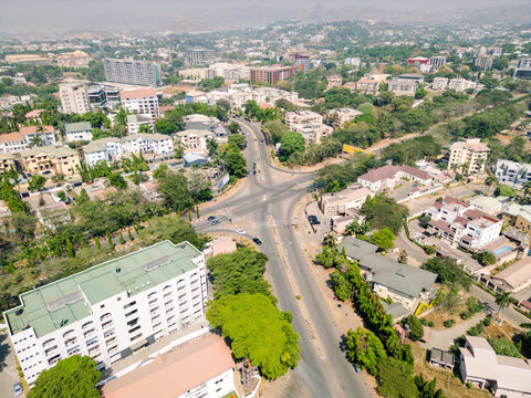Aerial view of streets lined with lush trees and buildings creating a vibrant tapestry of urban life, Abuja, Federal Capital Territory, Nigeria.