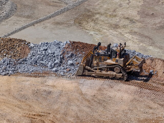 Huge D11 crawler tractor pushing rock material in mine dump © WILL PHOTOGRAPHY