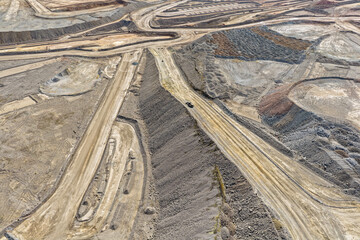 Obraz premium Panoramic view of enormous mining roads for the transport of minerals and mine waste