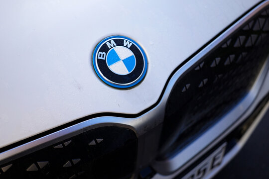 Germany. February 7, 2026. Close-up of a BMW logo on front grille of an white electrical model. Editorial and documentary use only. Logo and brand protected