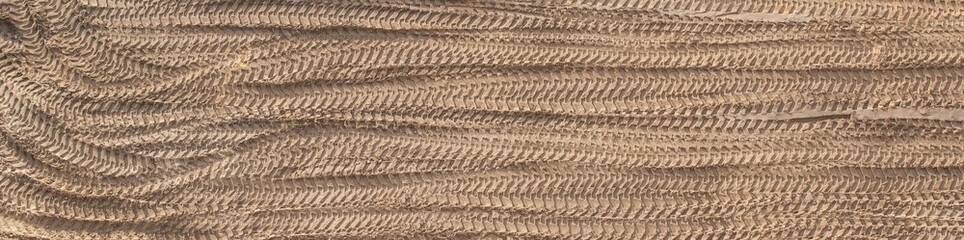 Numerous traces of construction machinery at the construction site