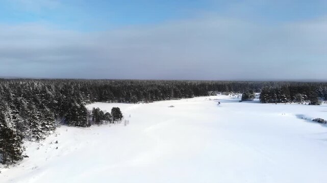 Snowy Fields Under Bright Sky. Expansive Winter Agricultural Area With Scattered Dwellings And Blue Sky. Media