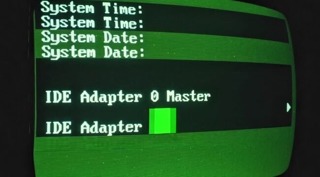 ): A retro-style CRT monitor displaying a vintage green-and-amber system diagnostics screen with technical data and hardware stats.
