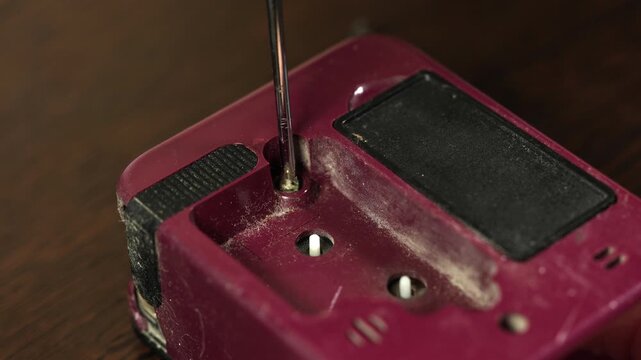 A watchmaker dismantles old watches for repairs.