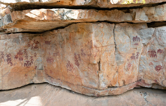 Prehistoric cave paintings on the surface of a natural rock shelter. La Batanera, Fuencaliente (Spain)