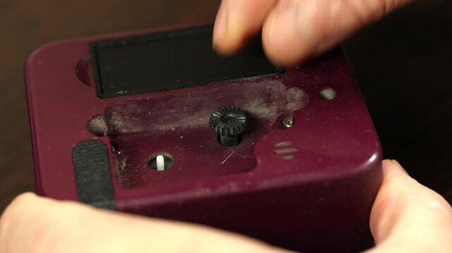 A watchmaker dismantles old watches for repairs.