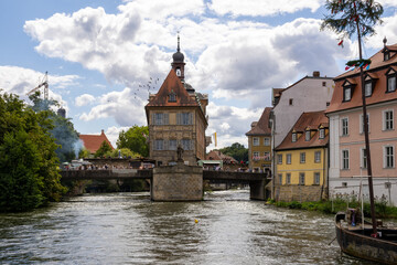 Fototapeta premium Altes Rathaus in Bamberg, Bavaria, Germany, iconic old town hall on an artificial island in the Regnitz River, connected by pedestrian bridges including Untere Brücke, featuring porcelain museum 