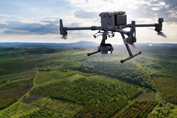 Agricultural drone flies over the field. Smart farming and digital transformation in agriculture.
