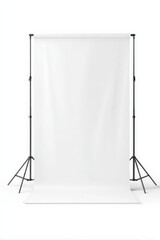 A plain white photography or video backdrop mounted on a black adjustable