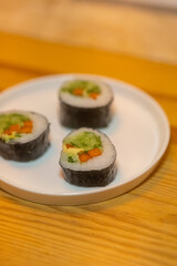 Close-Up of Salmon Kimbap on White Plate