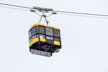 Aerial Cabin Suspended On Steel Line Against Overcast Sky