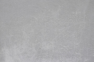 Smooth gray concrete surface with subtle texture and variations, ideal for backgrounds, design...
