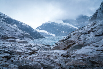 Nigardsbreen Glacier with Blue Ice and Rocky Valley in Norway