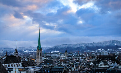 Fototapeta premium Winter cityscape with church towers after a snowfall in Zurich, Switzerland