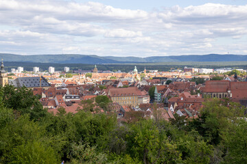 Fototapeta premium View from Michelsberg Monastery (Kloster St. Michael) in Bamberg, Bavaria, Germany, overlooking historic old town, vineyards and gardens, scenic UNESCO city panorama and European travel landmark.