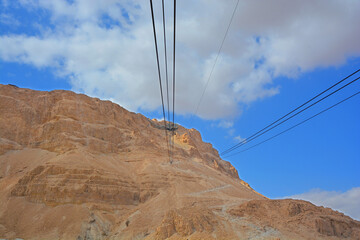 Masada is an ancient fortification in the Southern Israel situated on top of an isolated rock plateau, akin to a mesa. It is located on the eastern edge of the Judaean Desert