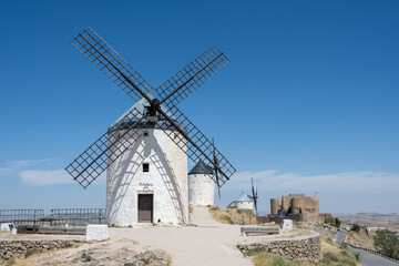 Traditional windmills in a scenic landscape