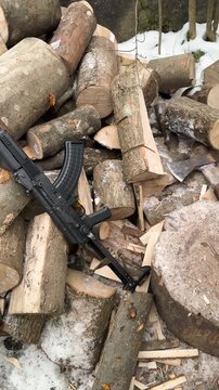 Ukraine: A Ukrainian soldier prepares firewood for the cold winter in the Carpathians to protect the border.