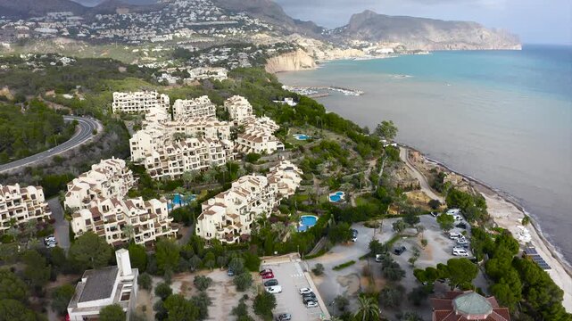 Aerial view of the housing developments with swimming pools in the Bay of Altea in Alicante, Spain.