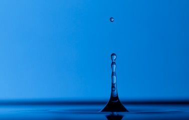 Color drops splash with umbrella or balls in fresh water