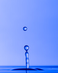 Color drops splash with umbrella or balls in fresh water